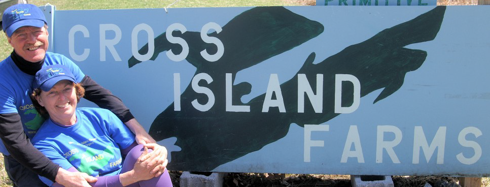Dani & David in front of Cross Island Farms sign